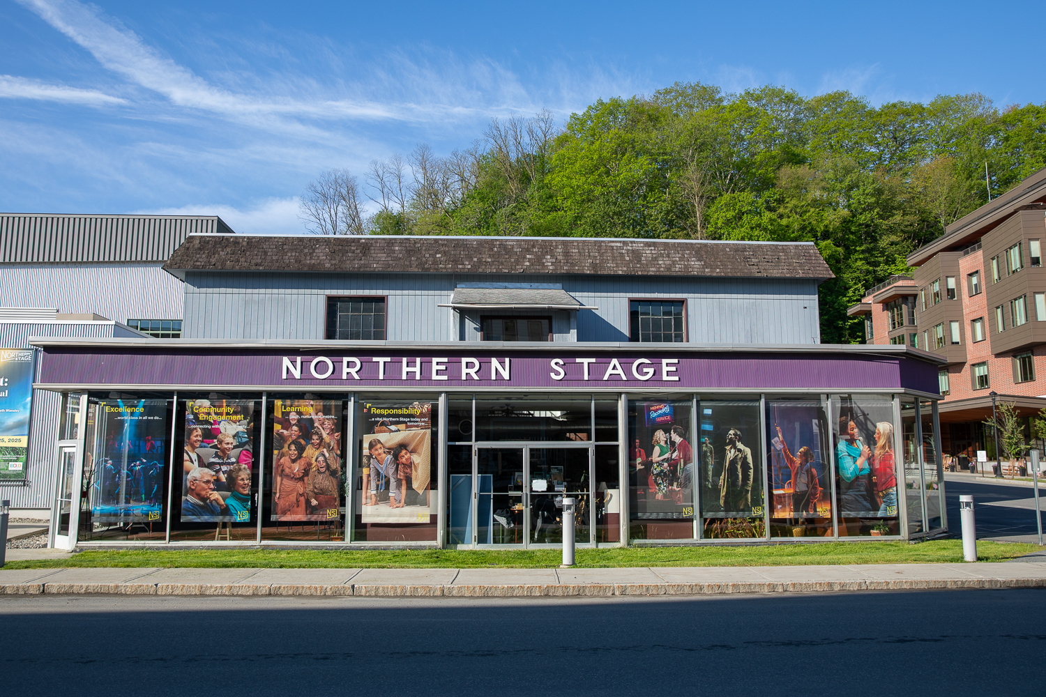 005A7443-2 the front of a building ith the words 'Northern Stage' on the front. In the windows are posters for upcoming events.