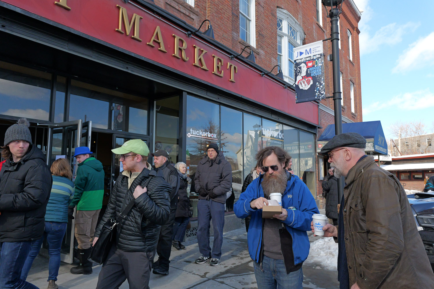 P1006148 A crowd standing outside of Newbury Market in White River Junction.